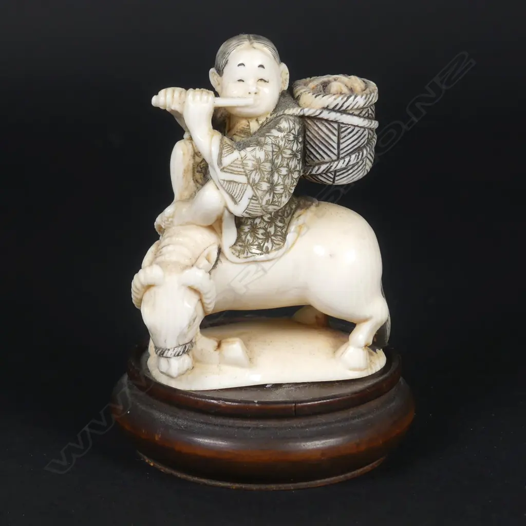 A Japanese small ivory okimono of a boy riding the bull home Image 1++