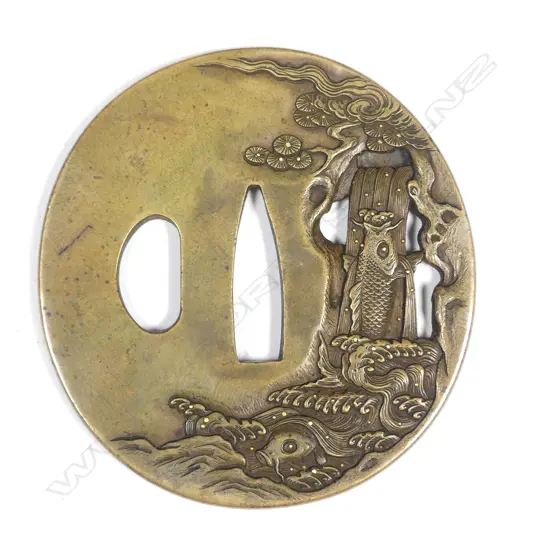 A Japanese yellow bronze tsuba