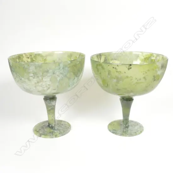 A pair of Chinese jade turned pedestal base cups