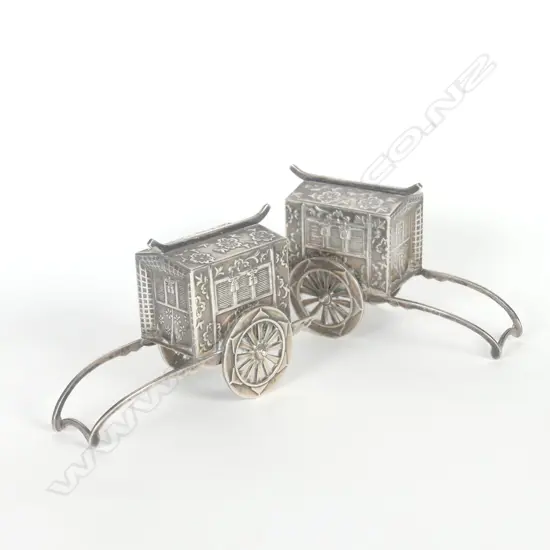 Two Chinese silver pepper/spice boxes modelled as rickshaw