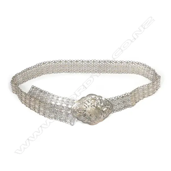 An Oriental vintage silver buckle and belt