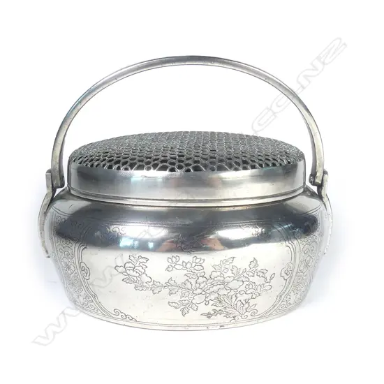 A Chinese Republic period white bronze hand warmer