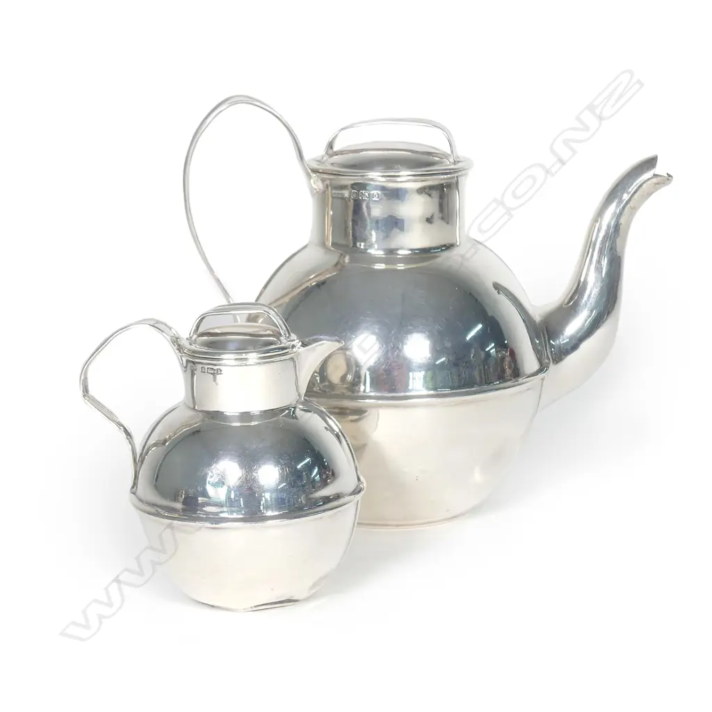 An Edwardian silver teapot and cream jug Image 1++