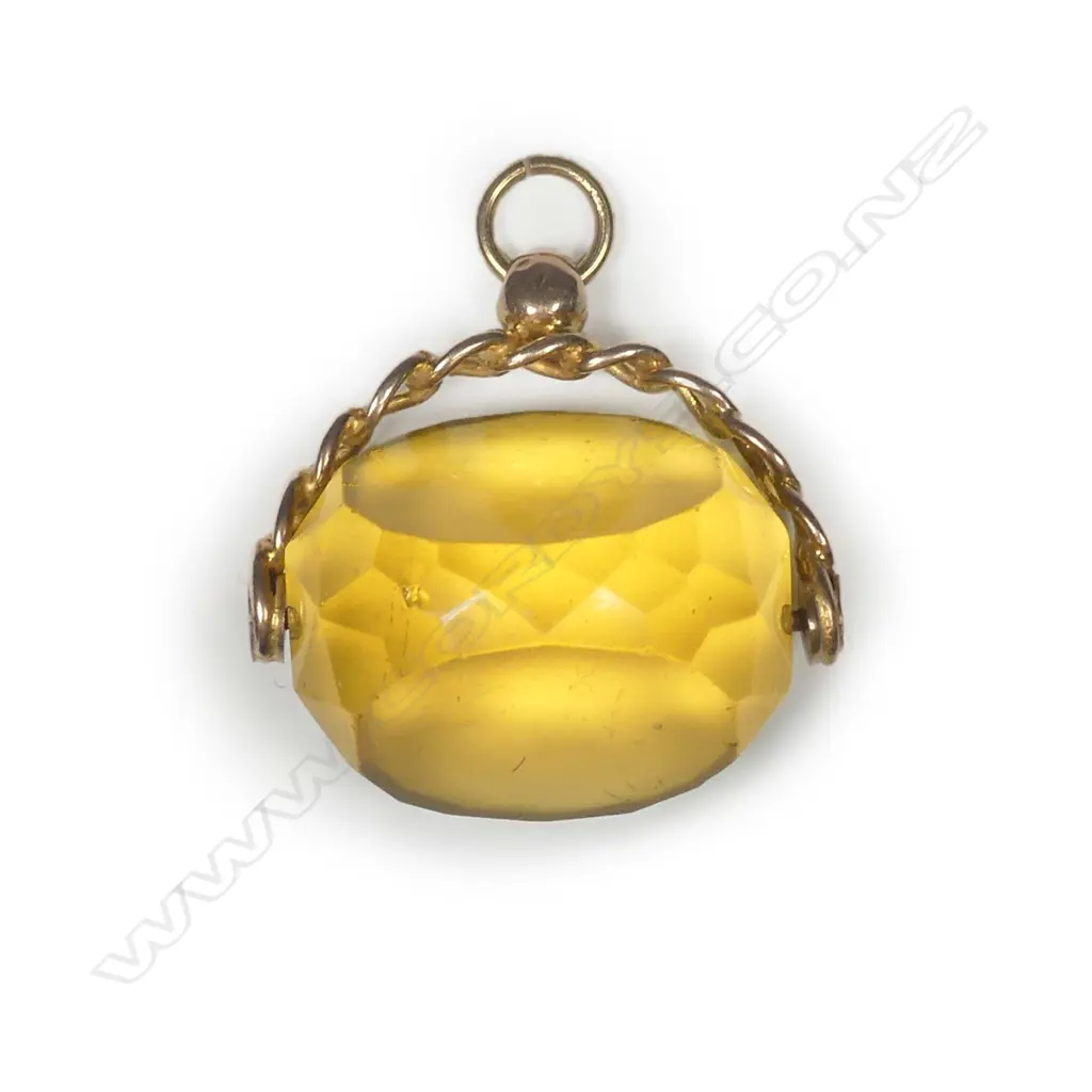 A 9ct yellow gold and faux citrine fob spinner Image 1++