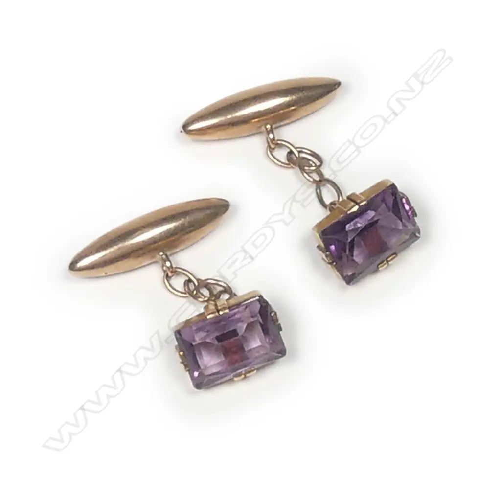 A pair of early 20thC 9ct. rose gold and amethyst cufflinks Image 1++