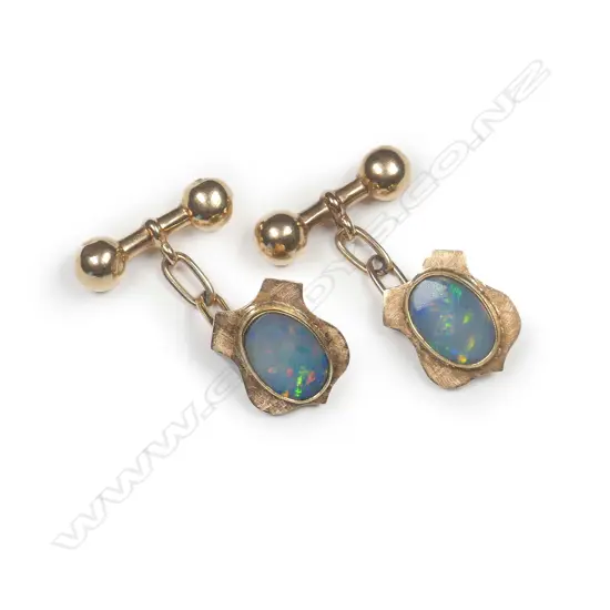 A pair of 15ct gold and opal cufflinks