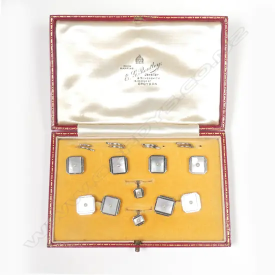 A set of 9ct. white gold mother-of-pearl and seed pearl gentleman's shirt studs and cufflinks