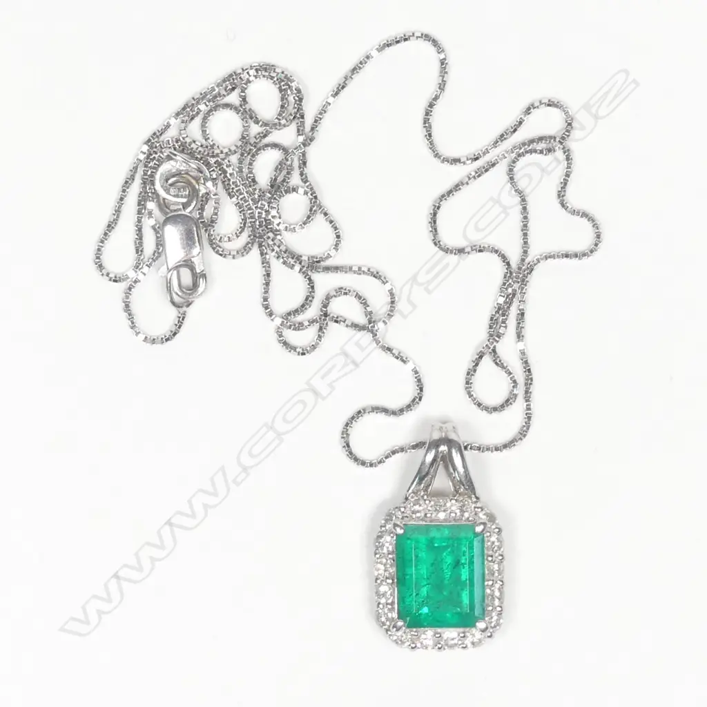 A modern platinum emerald and diamond pendant on chain Image 1++