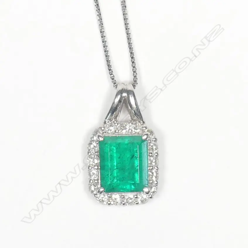 A modern platinum emerald and diamond pendant on chain Image 1++