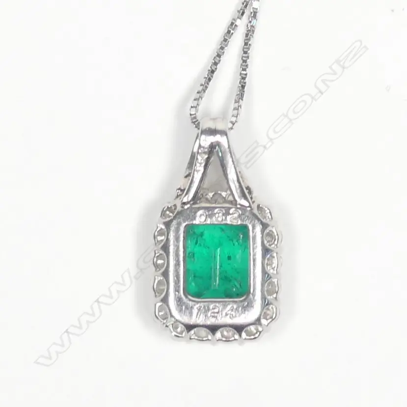 A modern platinum emerald and diamond pendant on chain Image 1++