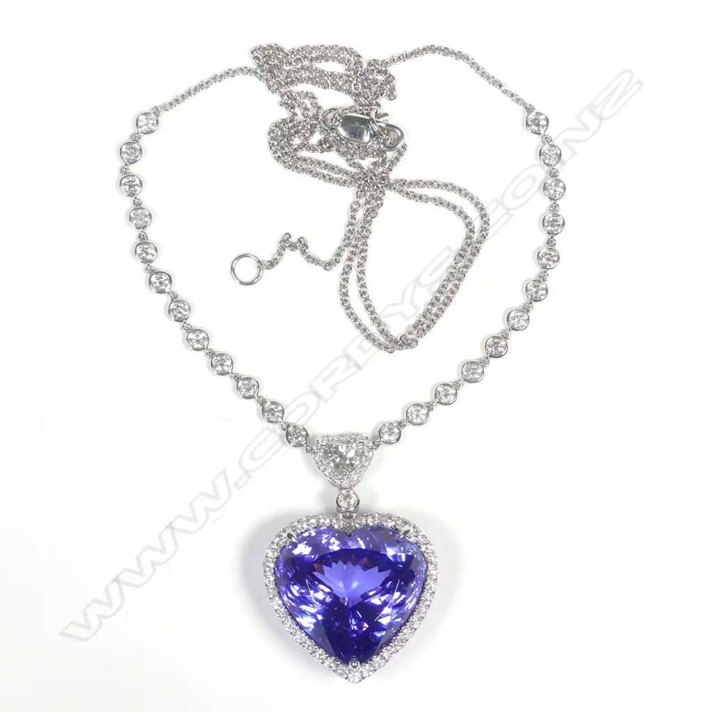 A 14ct white gold tanzanite and diamond pendant Image 1++