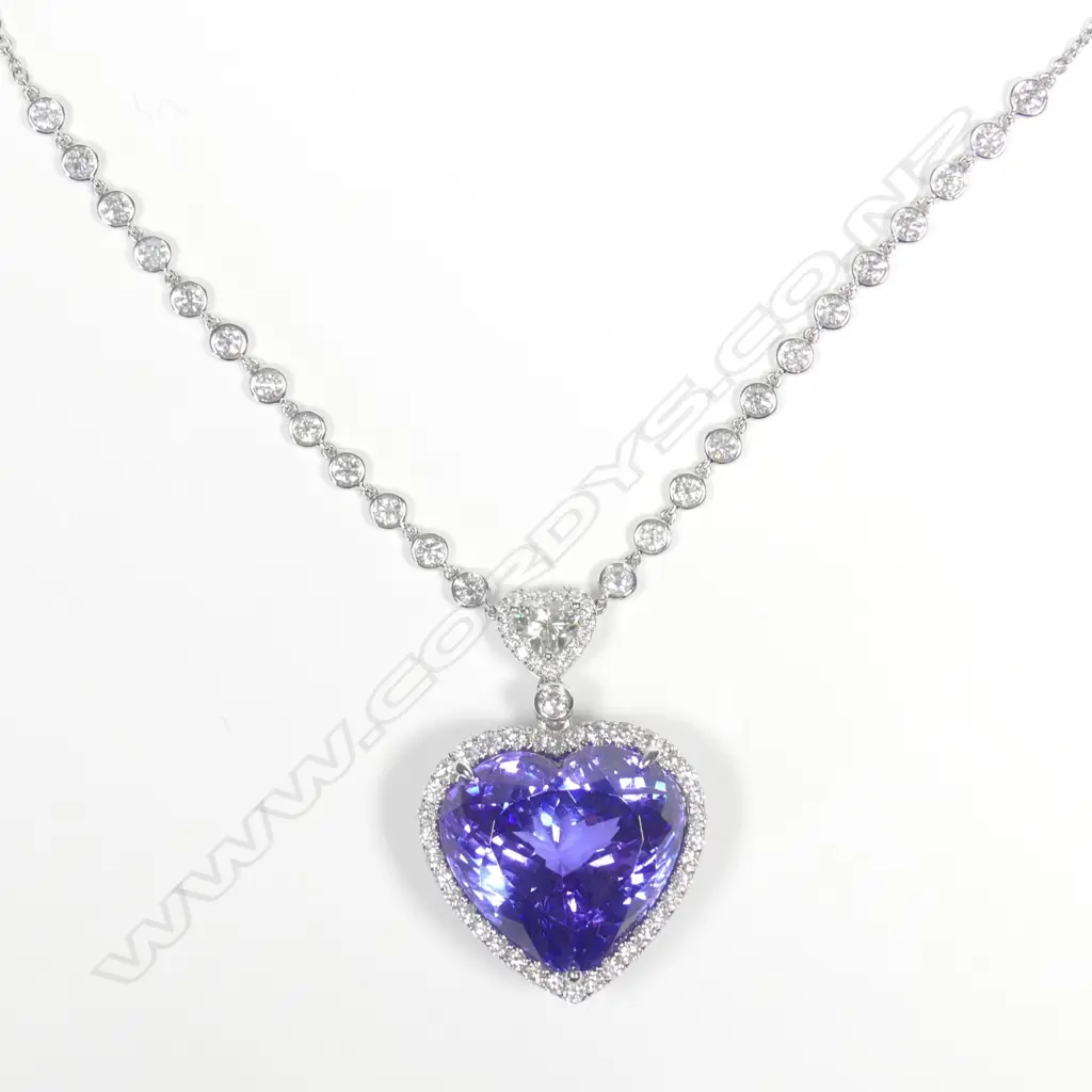 A 14ct white gold tanzanite and diamond pendant Image 1++