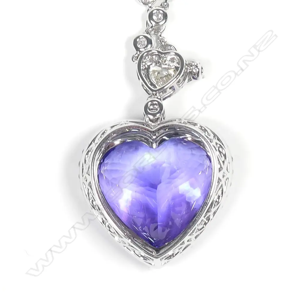 A 14ct white gold tanzanite and diamond pendant Image 1++