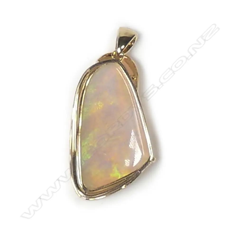 A 14ct gold opal and diamond pendant Image 1++