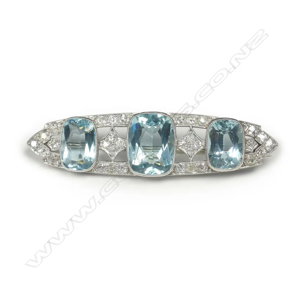 An 18ct white gold platinum aquamarine and diamond Art Deco brooch Image 1++