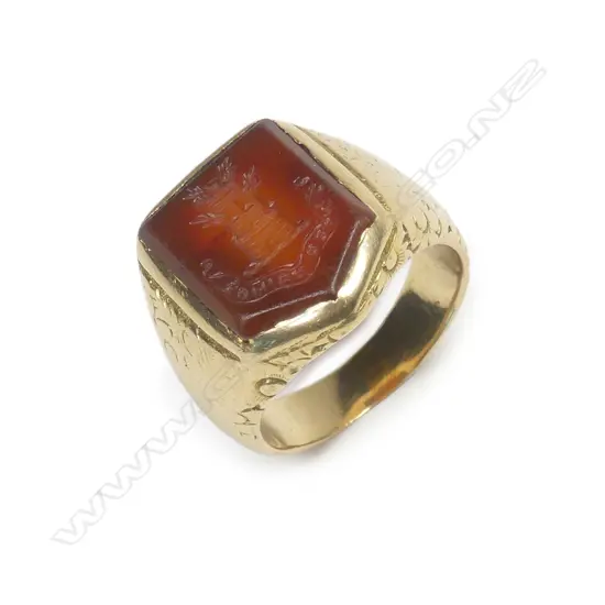 An old 18ct yellow gold and carnelian panelled seal ring