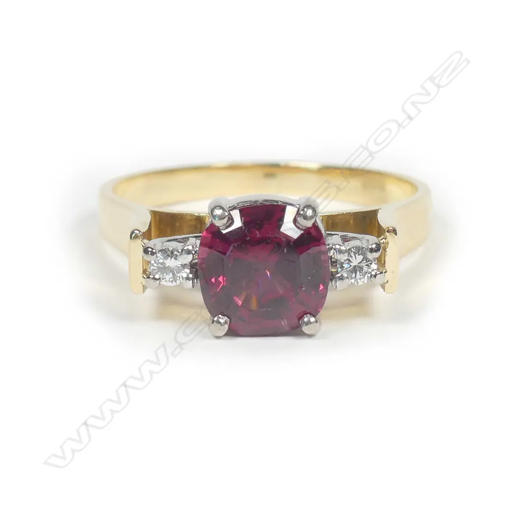 An 18ct gold garnet and diamond ring Image 1++