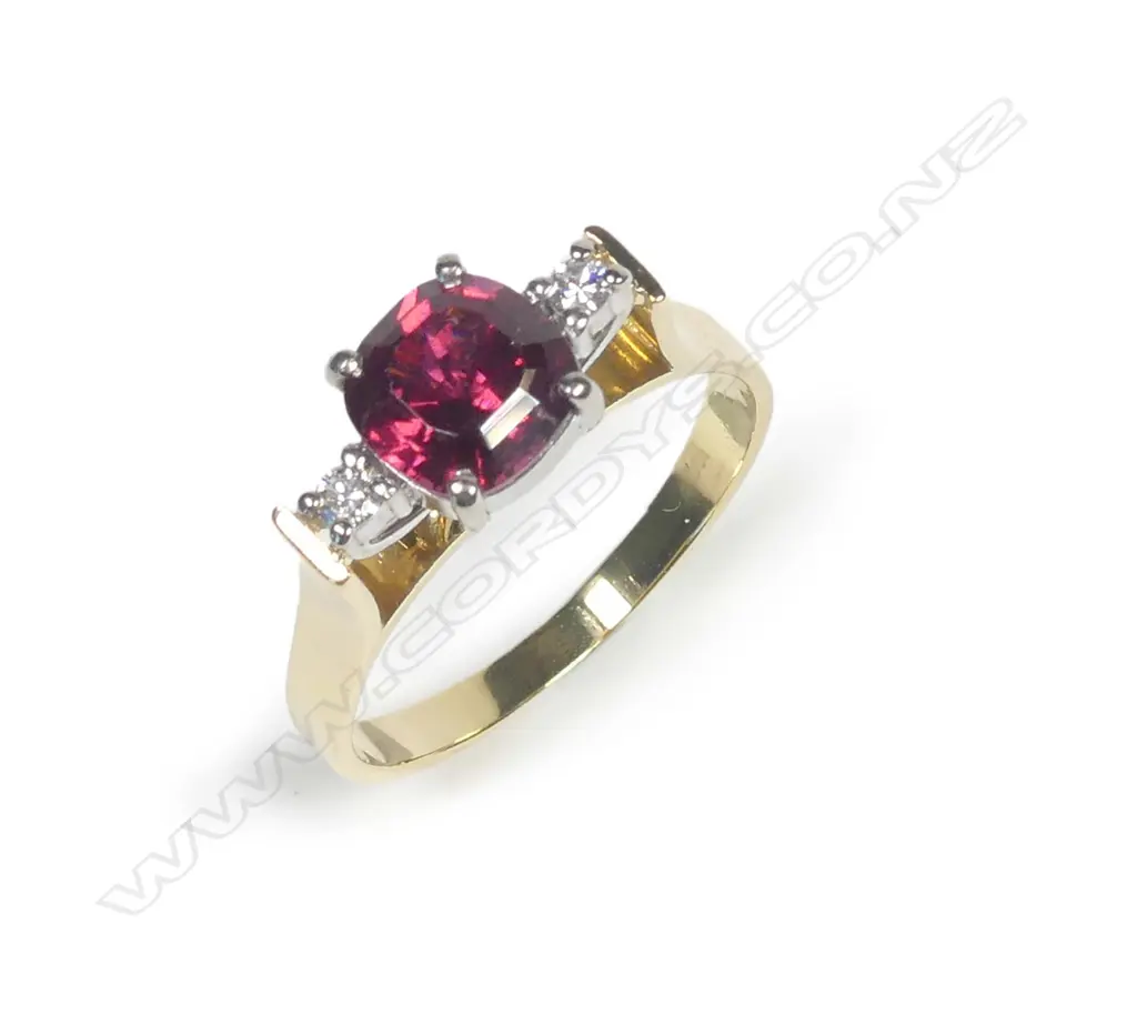 An 18ct gold garnet and diamond ring Image 1++