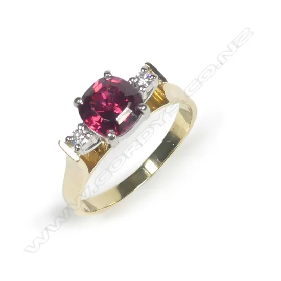 An 18ct gold garnet and diamond ring