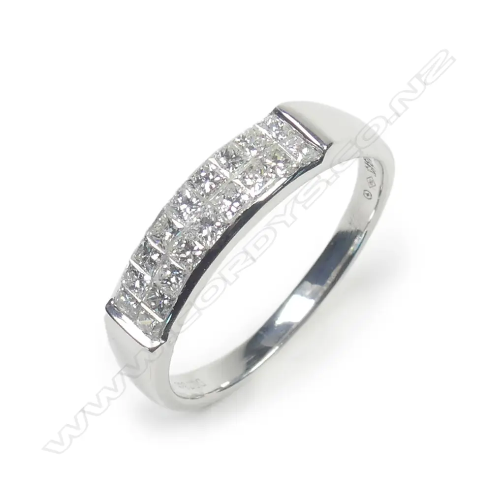 An 18ct white gold and diamond set band Image 1++