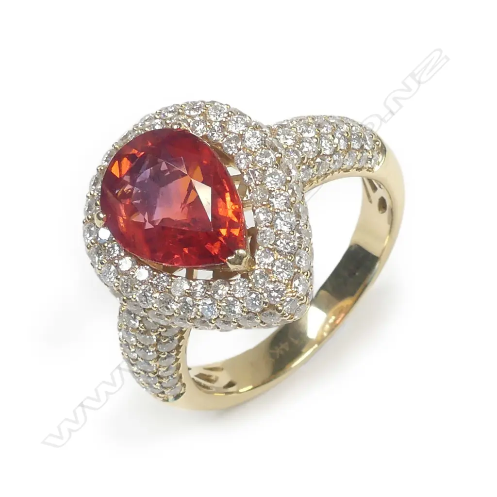 A 14ct gold orange sapphire and diamond ring Image 1++