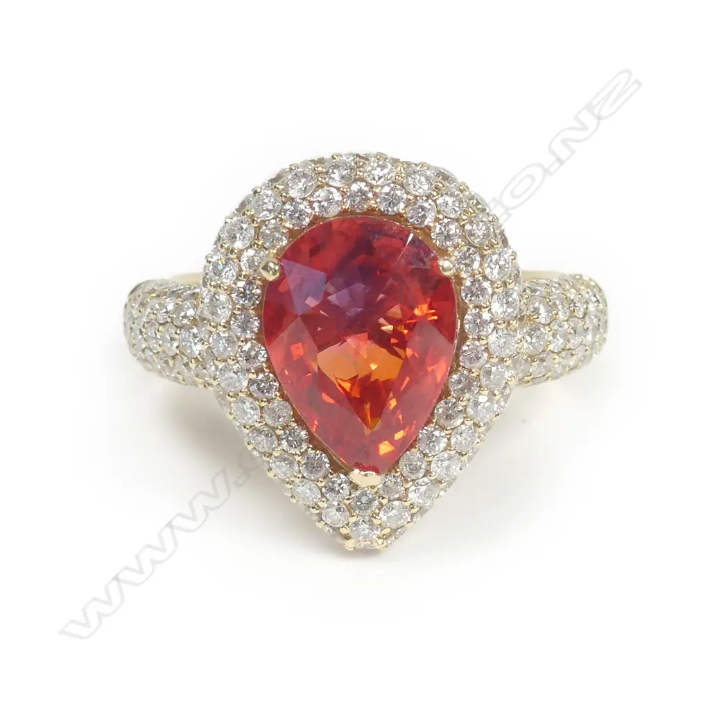 A 14ct gold orange sapphire and diamond ring Image 1++