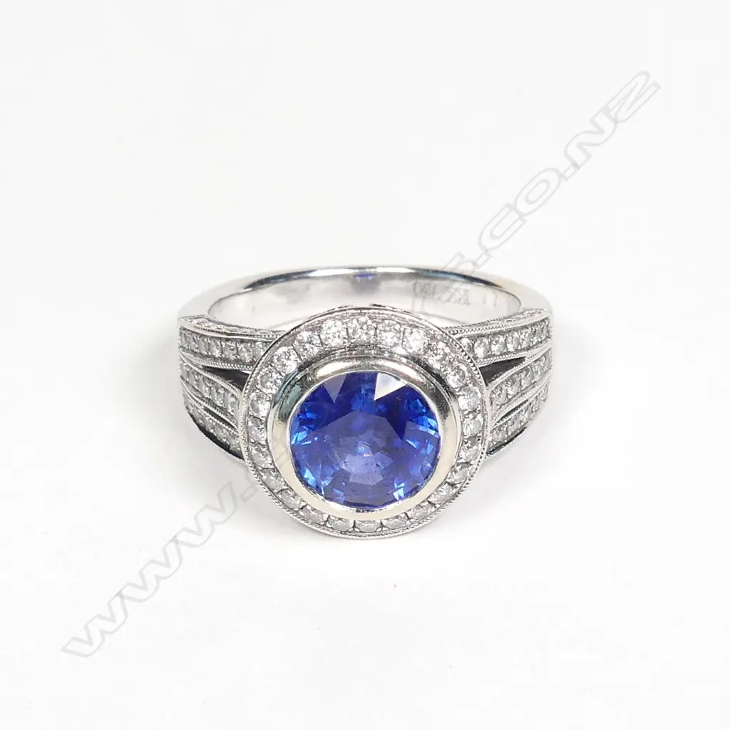 An 18ct. white gold sapphire and diamond ring Image 1++