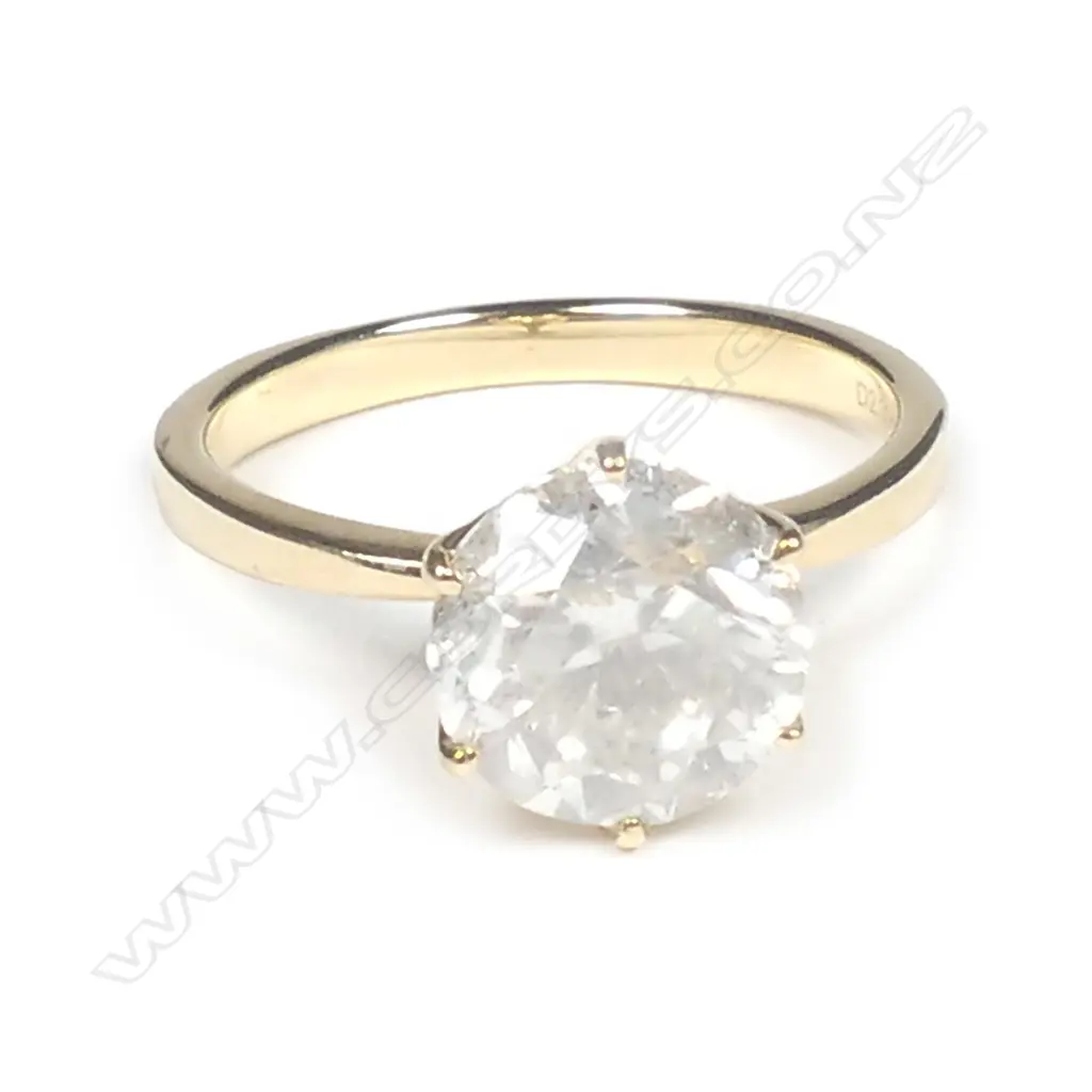 A 14ct gold and diamond solitaire ring Image 1++