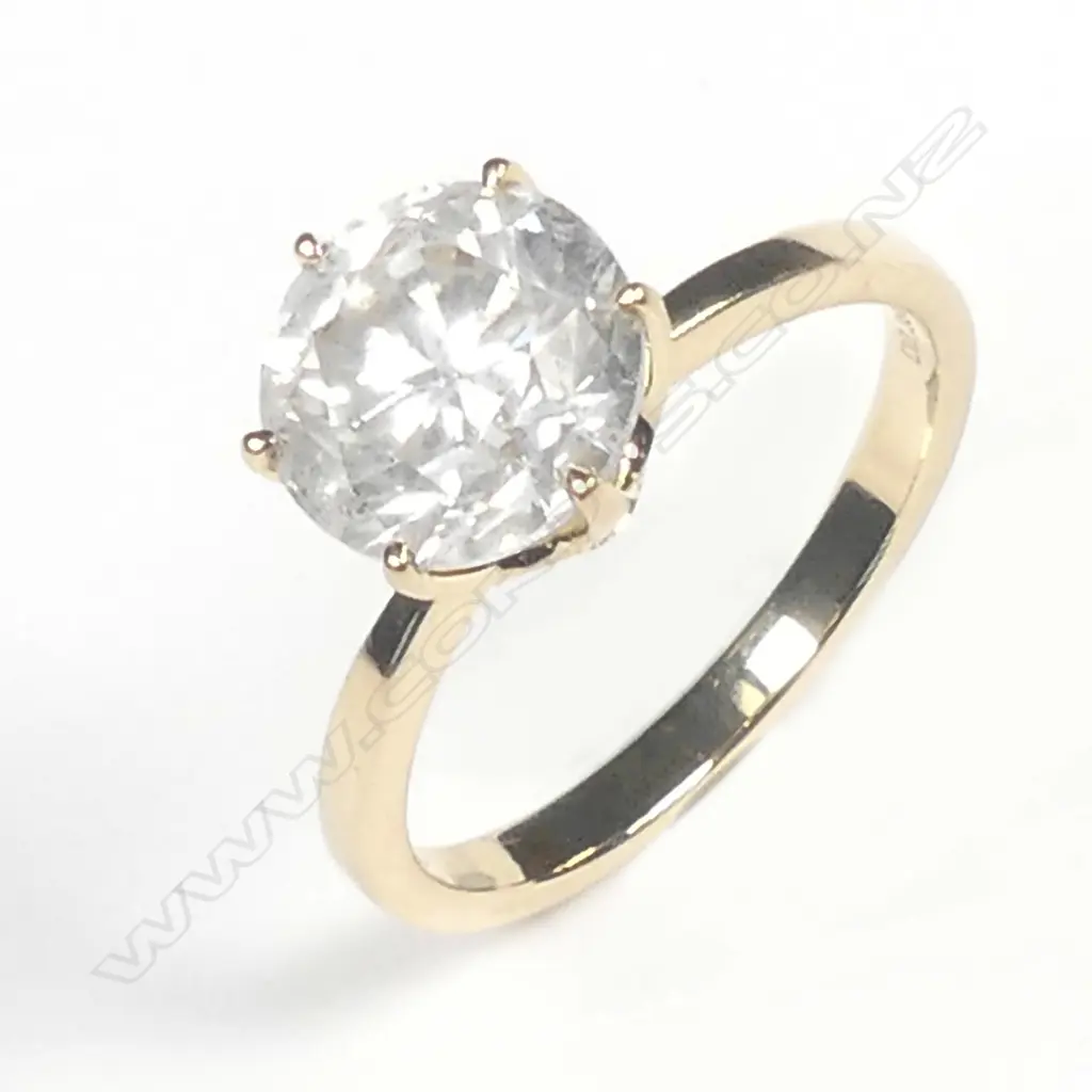 A 14ct gold and diamond solitaire ring Image 1++