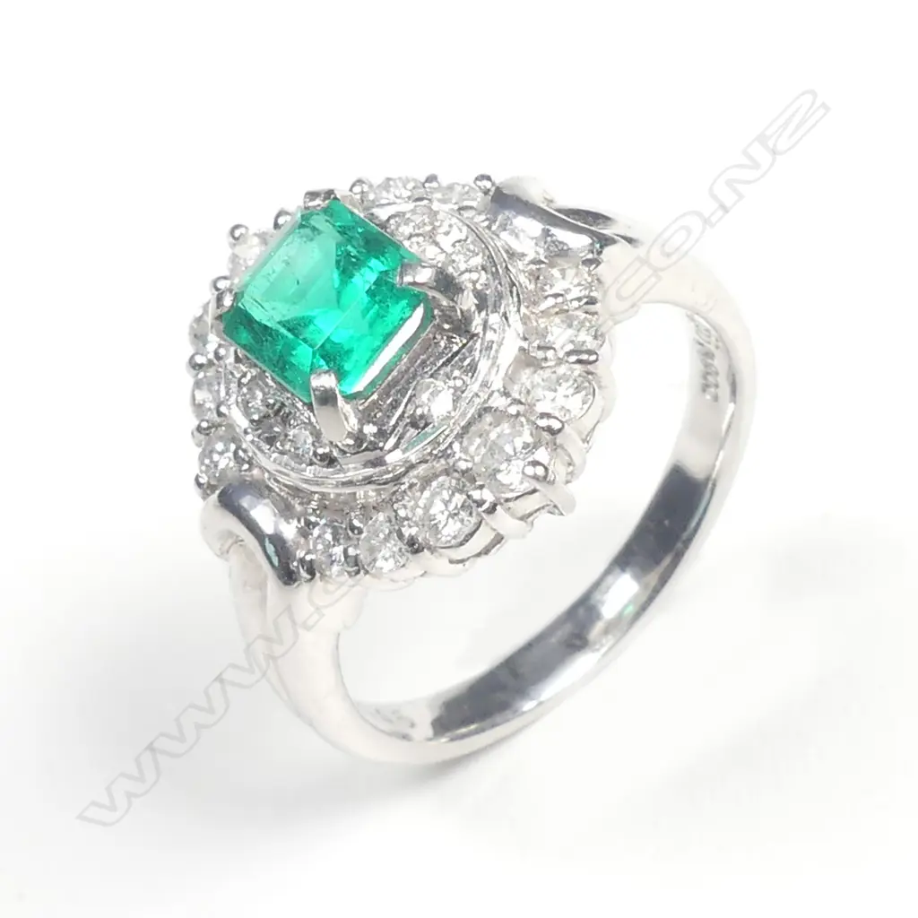 A platinum emerald and diamond dress ring Image 1++