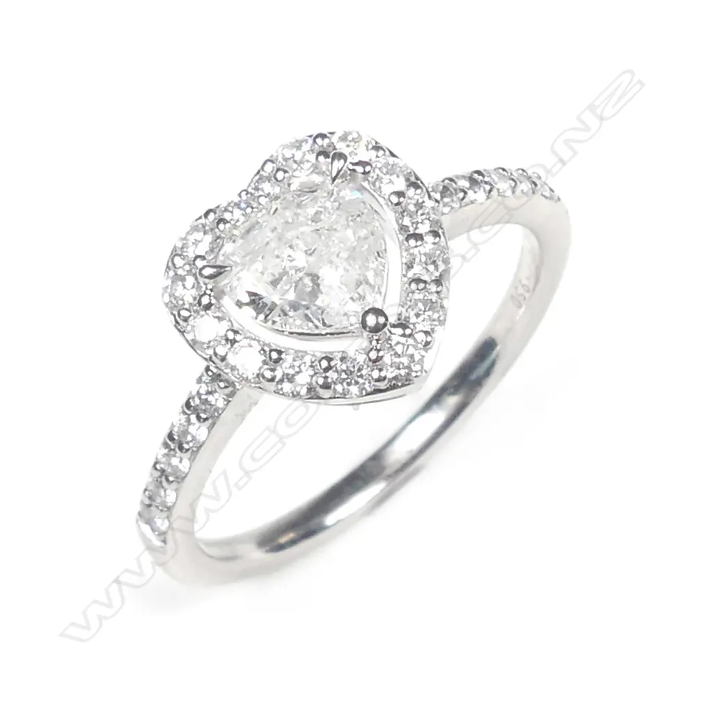 A platinum and diamond halo ring Image 1++