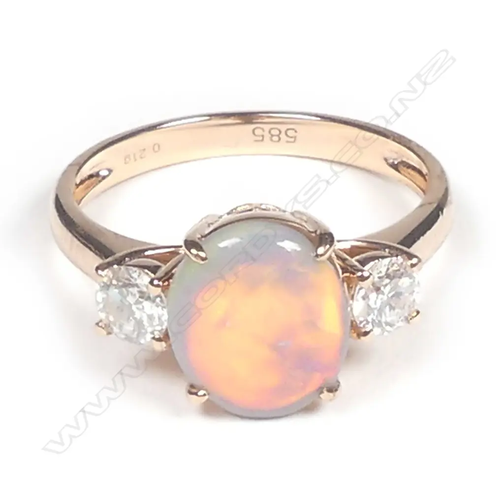 A 14ct rose gold opal and diamond ring Image 1++