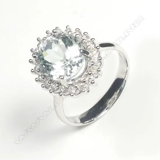 A 14ct white gold aquamarine and diamond ring