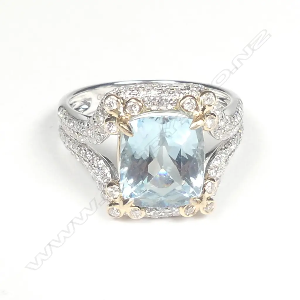 A lady's modern 14ct. white gold aquamarine and diamond dress ring Image 1++