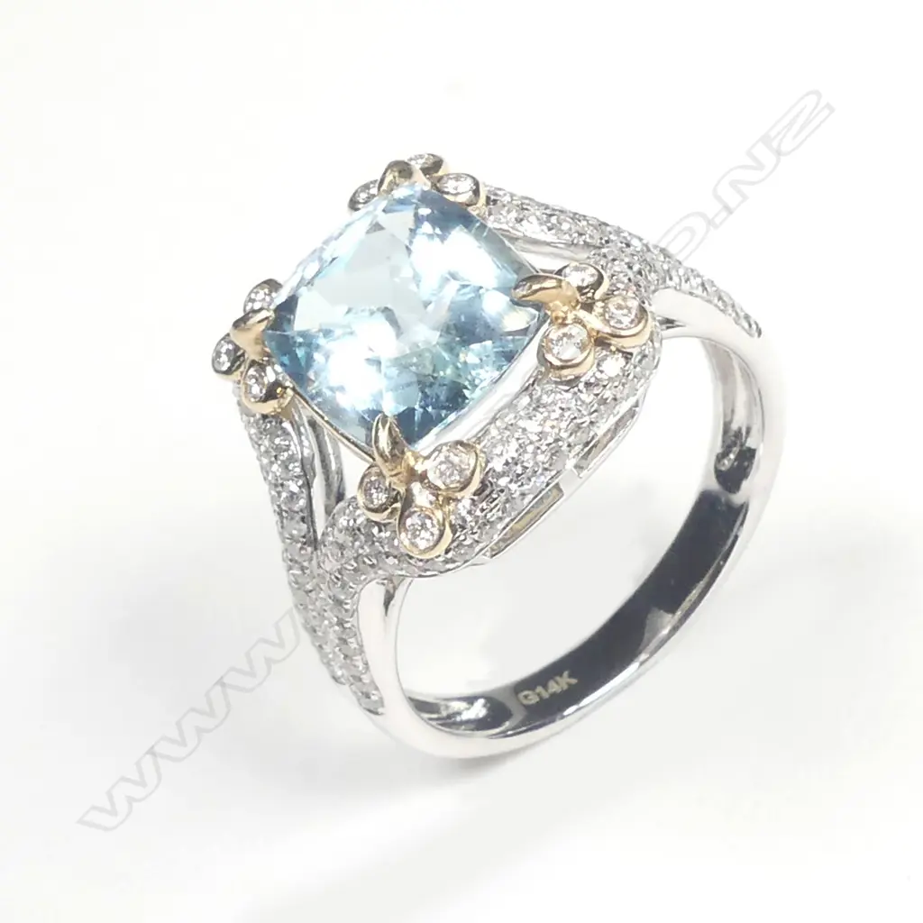 A lady's modern 14ct. white gold aquamarine and diamond dress ring Image 1++