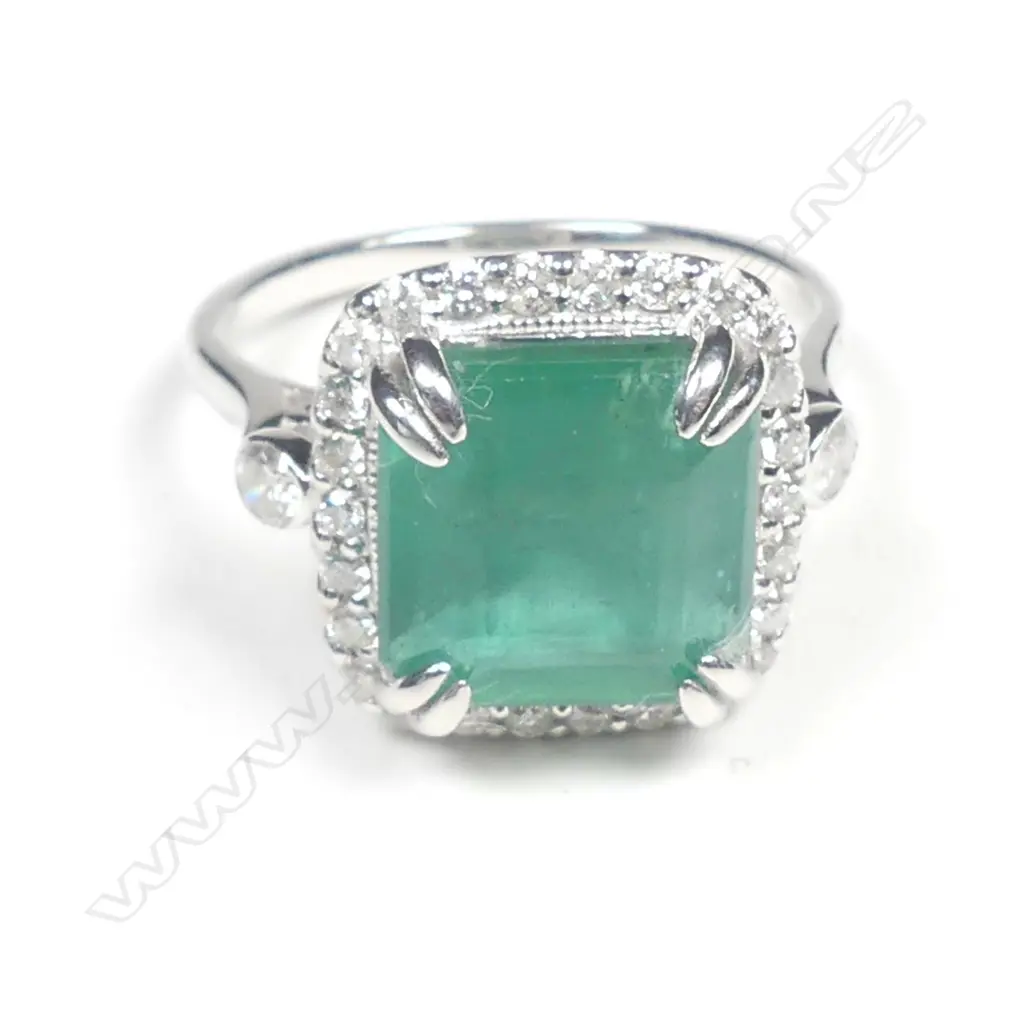 A 14ct white gold emerald and diamond ring Image 1++