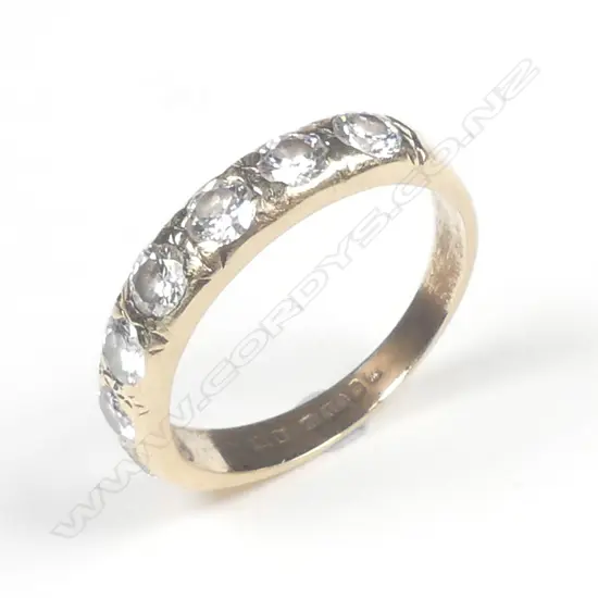 An estate 9ct gold and seven stone diamond ring