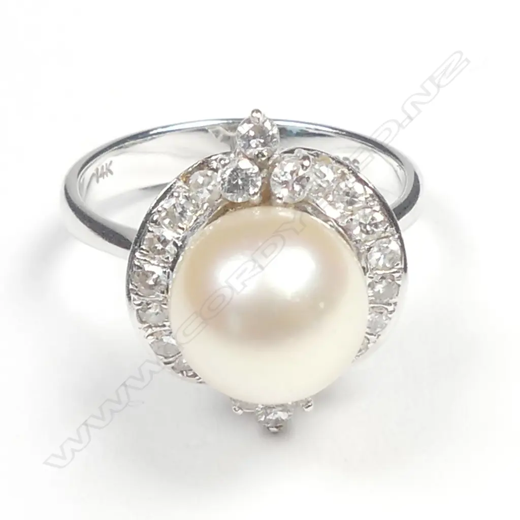 A 14ct. white gold pearl and diamond dress ring Image 1++
