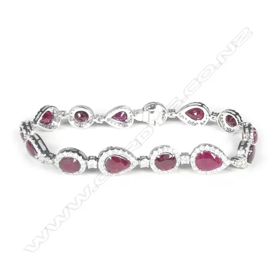 A platinum ruby and diamond halo bracelet
