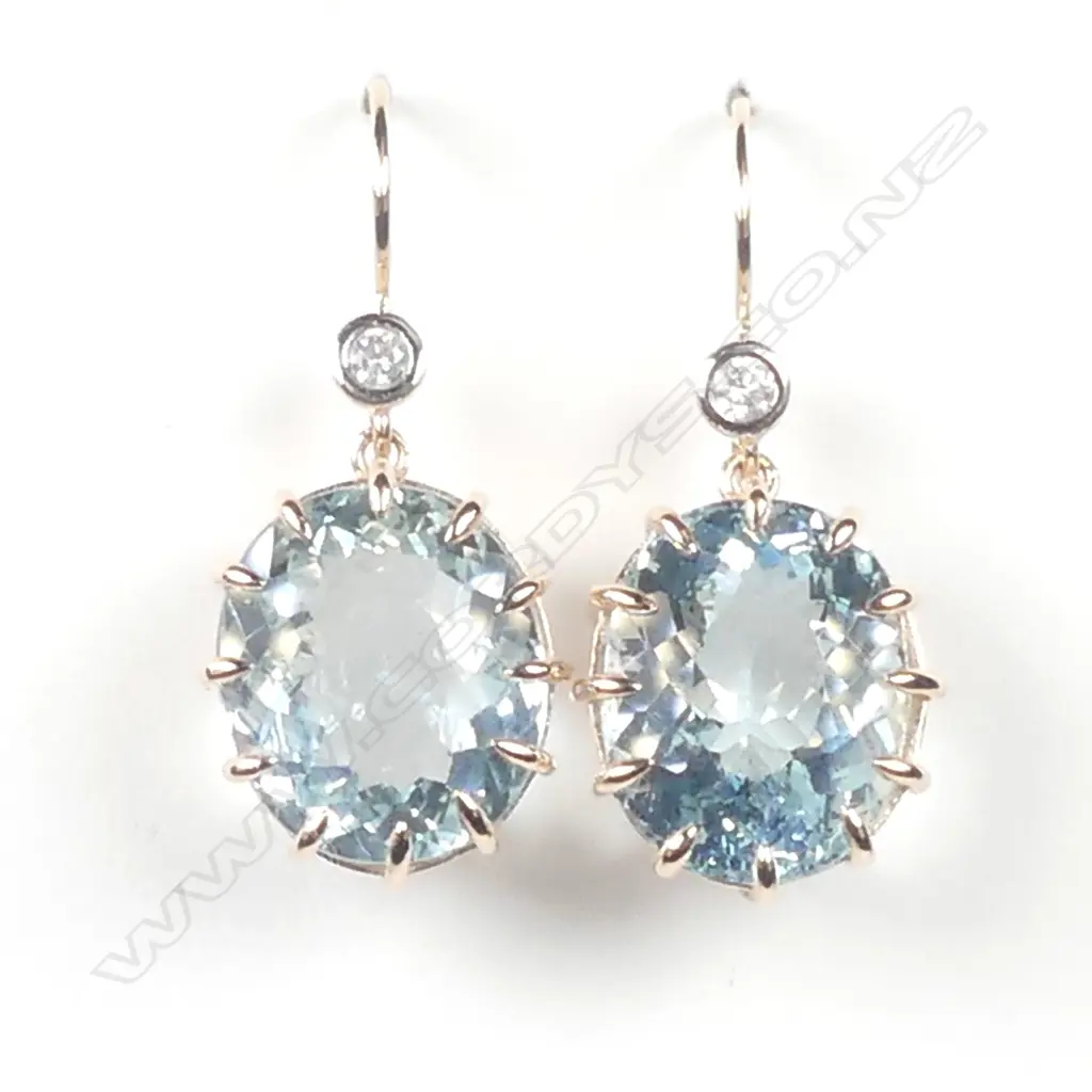 A pair of 14ct rose gold aquamarine and diamond earrings Image 1++