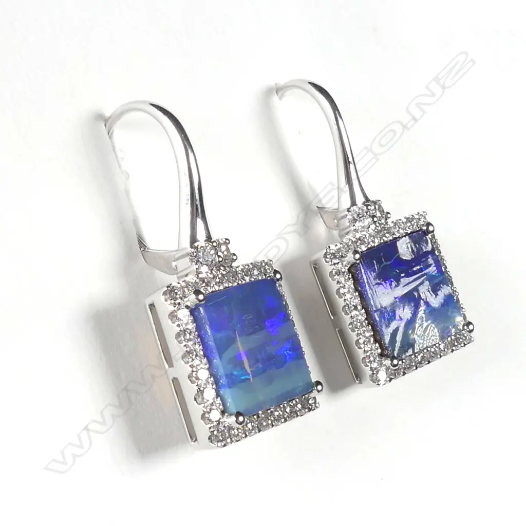 A pair of 14ct white gold opal and diamond drop earrings Image 1++