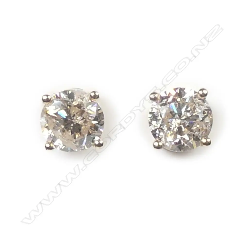 A pair of 14ct gold diamond stud earrings Image 1++