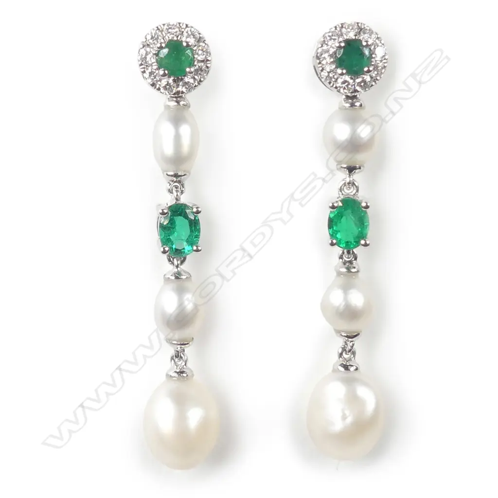 A pair of 14ct white gold pearl emerald and diamond drop earrings Image 1++