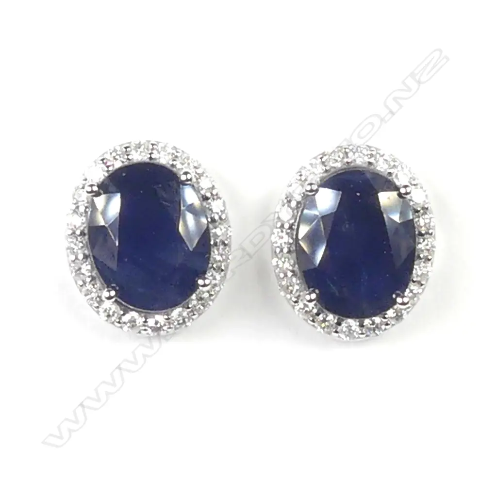 A pair of 14ct white gold sapphire and diamond earrings Image 1++