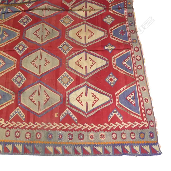A vintage large kilim carpet