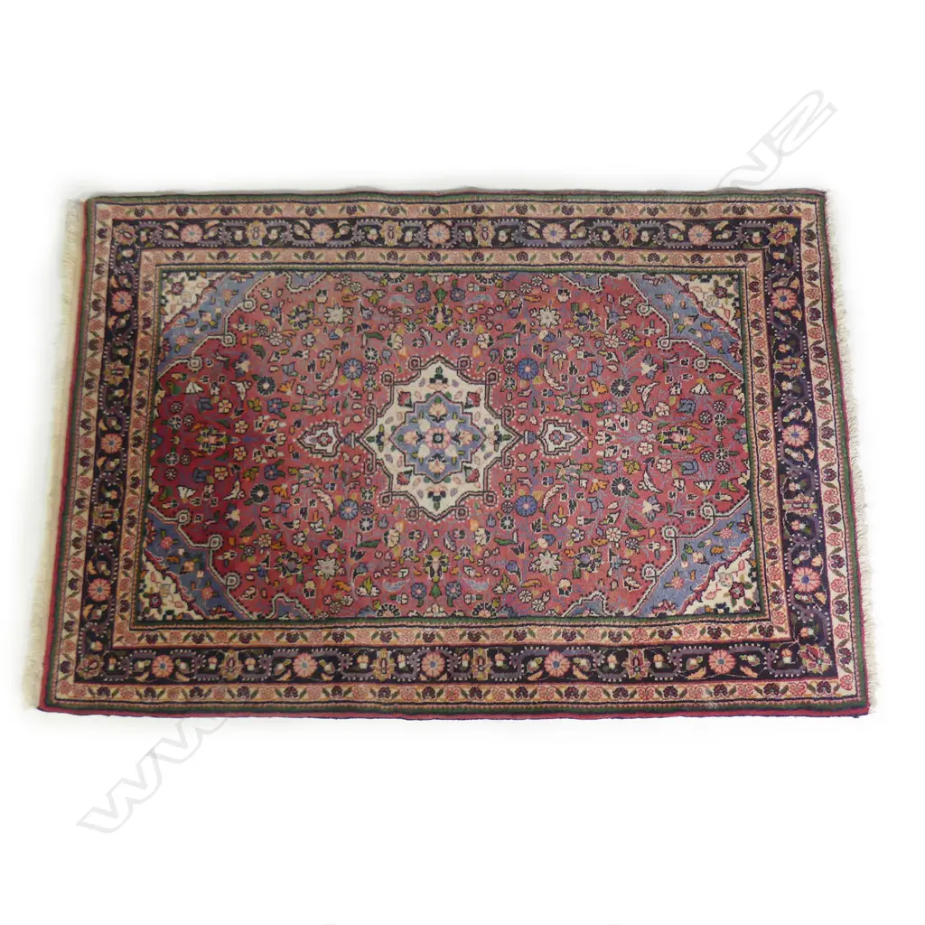 An Iranian wool rug Image 1++