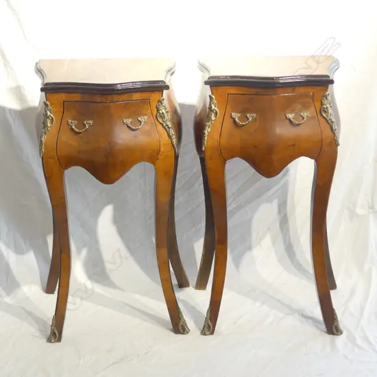 A pair of French style walnut bombe bedside cabinets