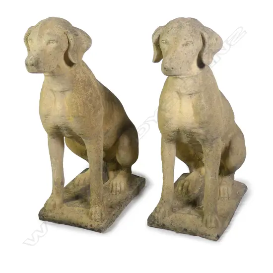 A pair of Church Stone classical seated hunting dogs
