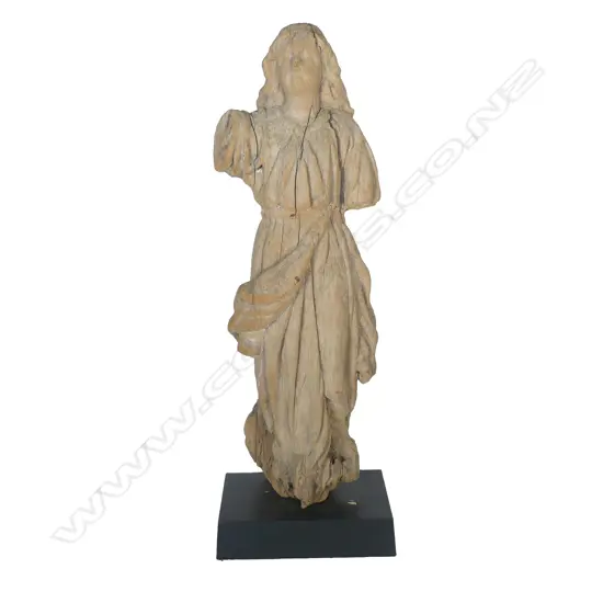 An attractively weathered carved wood statuette of a saint