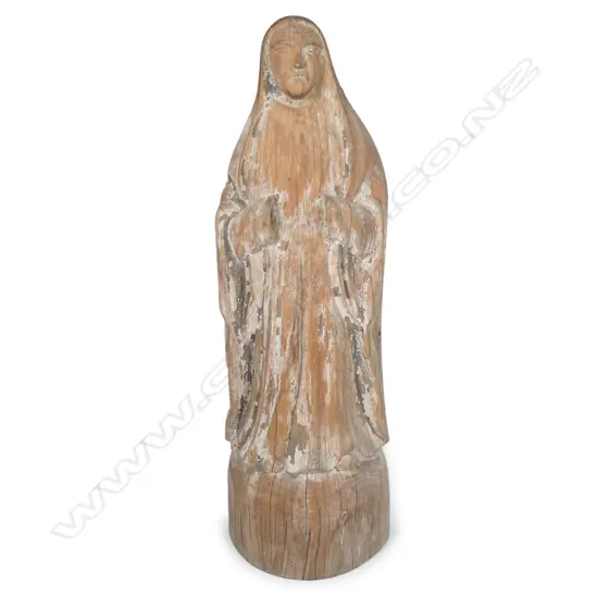 A carved wood statuette of the Virgin Mary